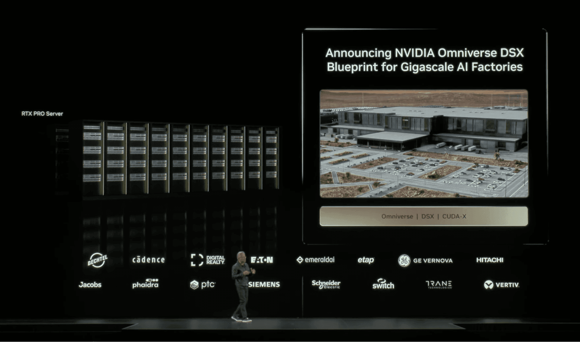 Jensen Huang announces the NVIDIA Omniverse DSX blueprint for gigascale AI factories, with partner logos including Phaidra displayed on stage at GTC DC.